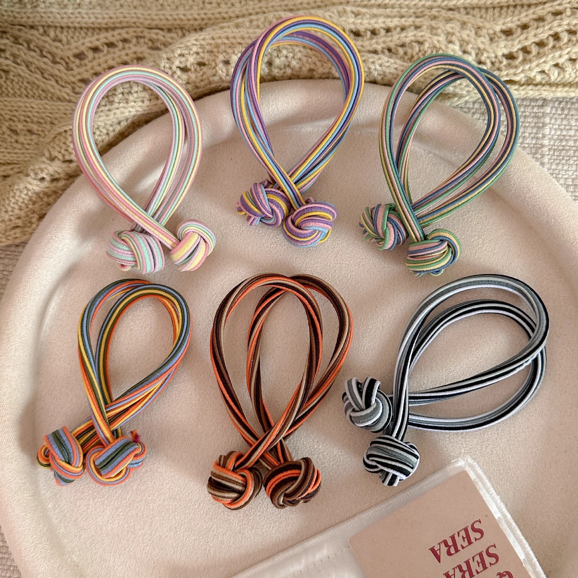 Anillo de cabello de nudo de cola de cabello de alta elasticidad no lesionar cabello de banda de goma roja durable cabello de cola de cabello de mujer al por mayor