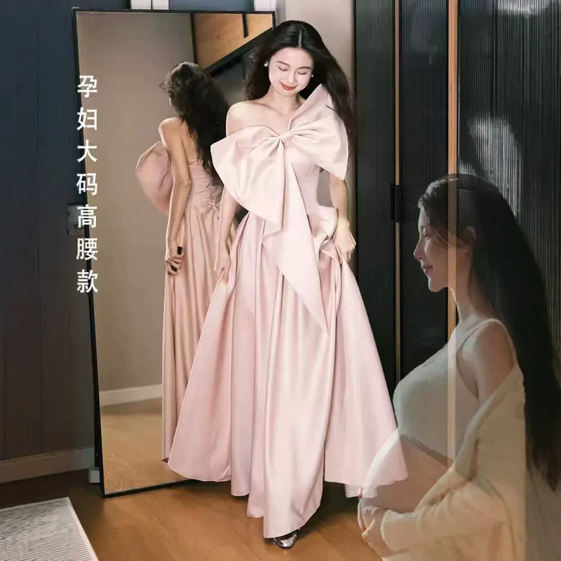 Pink off-shoulder maternity evening dress with large bow, high waist, belly-covering, satin, large hem, plus size, for engagement party Pink off-shoulder maternity evening dress with large bow, high waist, belly-covering, satin, large hem, plus size, for engagement party