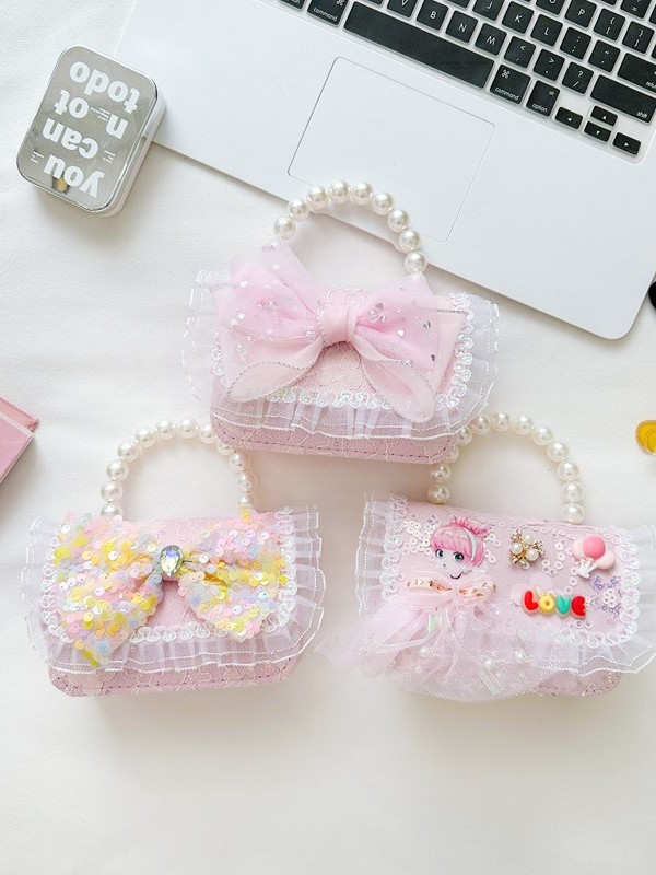 Primavera y verano nuevos bolsos infantiles, bolsos de perlas de arco, bolsos de mano, princesa de estilo extranjero, bolsos de cambio de hombro