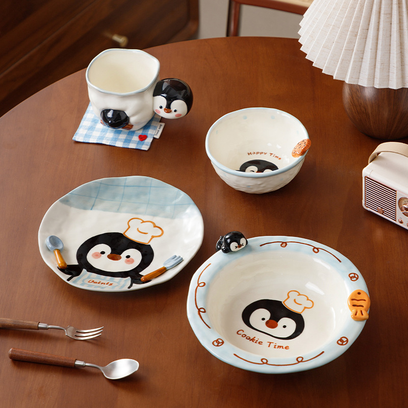 Cute and fresh penguin-shaped tableware set made of ceramic material for home use, including bowl, plate, and cup for one person