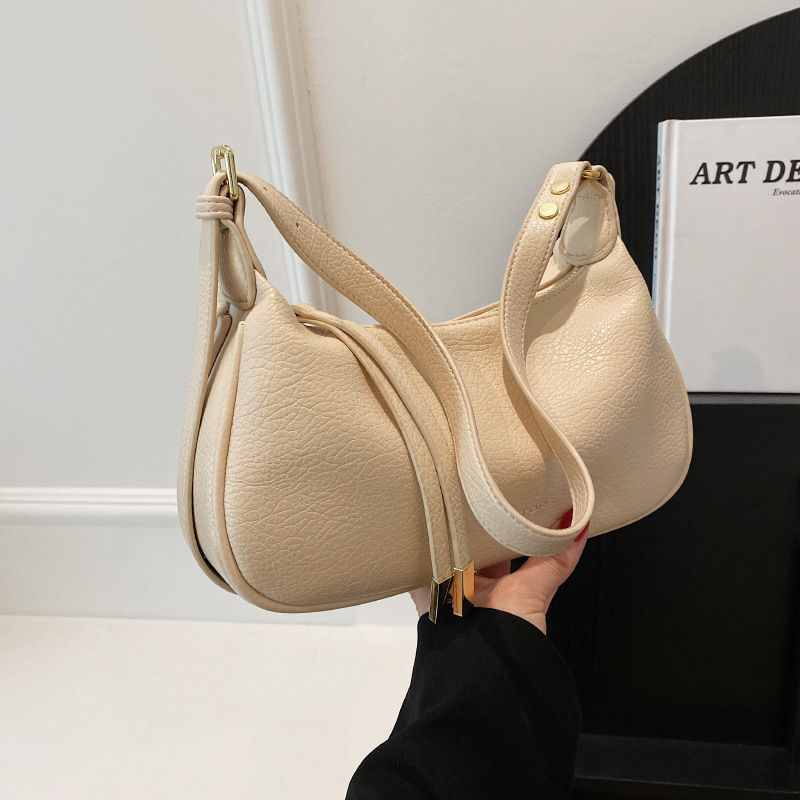 Bolso de hombro cruzado de alta calidad para mujer, nuevo estilo, con patrón de lichi, bolso de moda de nicho, tipo dumpling.