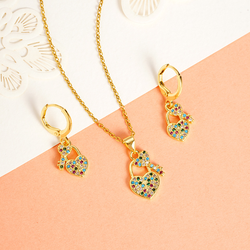 Vietnam Shajin estilo europeo y americano diamante color hueco cerradura de amor collar pendiente de dos piezas joyería al por mayor