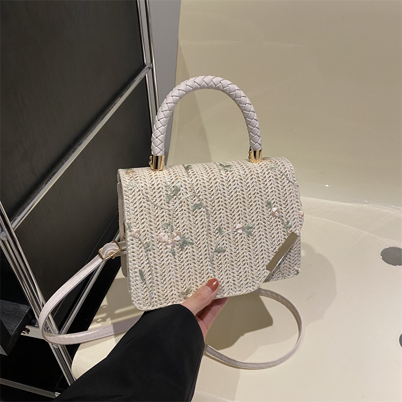 Diseño de nicho de alta sensación de tejido pequeño bolso cuadrado para mujeres 2024 nueva moda de paja bordada mochila de hombro