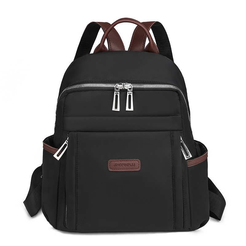 Venta al por mayor transfronteriza 2024 invierno nuevo estilo casual damas mochila de nailon simple y versátil mochila de viaje ligera marea