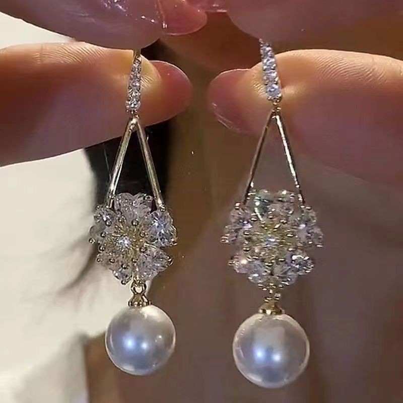Long elegant fashionable earrings with zircon