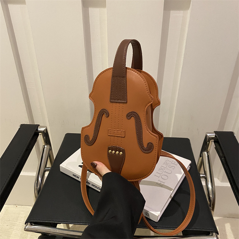 Europa y Estados Unidos personalidad órgano guitarra mochila de invierno para mujeres 2024 nuevo estilo extranjero bolso de hombro creativo de moda violín