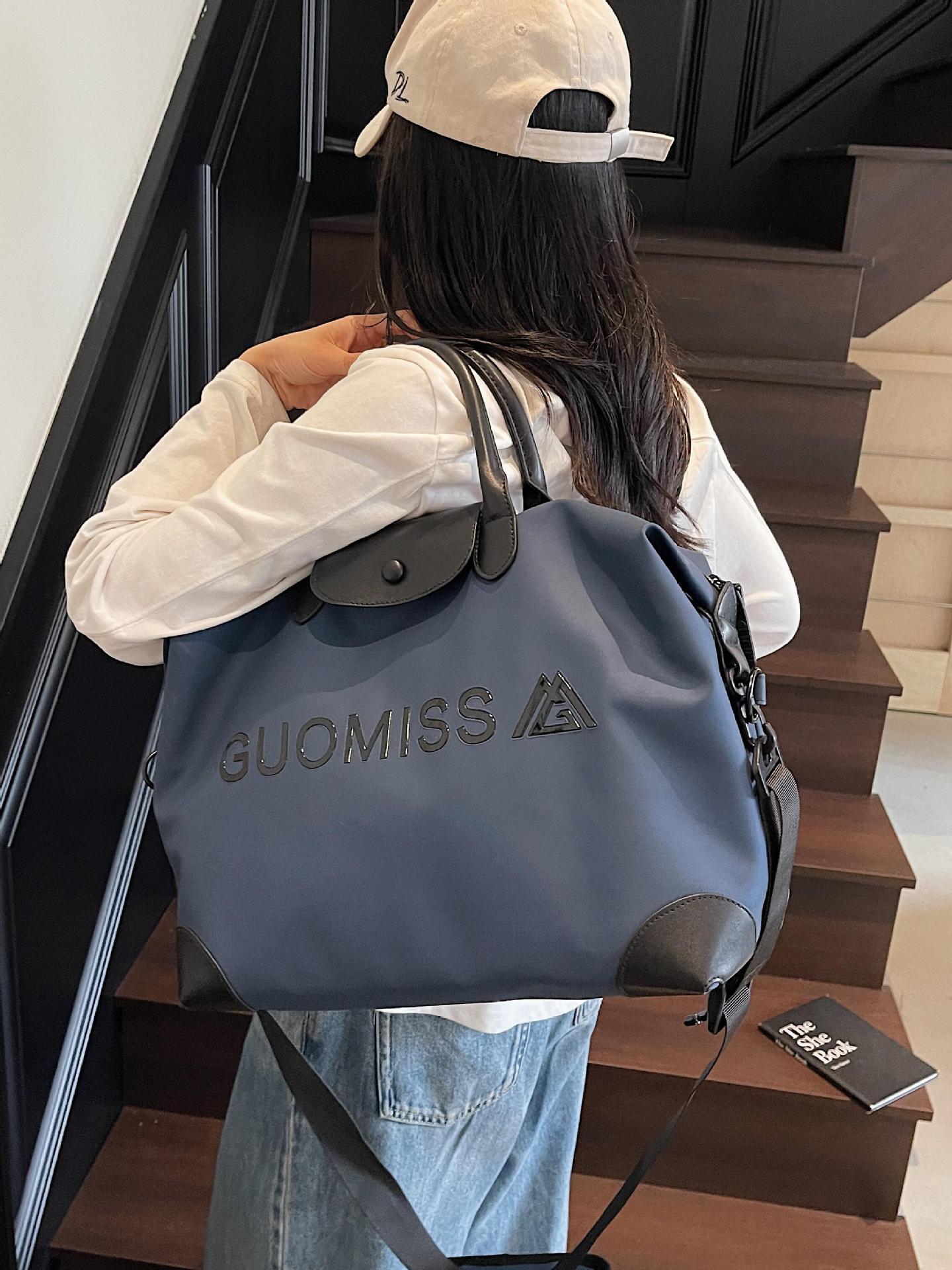 Bolsa de viaje para mujer transfronteriza nueva bolsa de gimnasio de yoga portátil de gran capacidad súper caliente bolsa de equipaje de viaje de corta distancia bolsa de mensajero