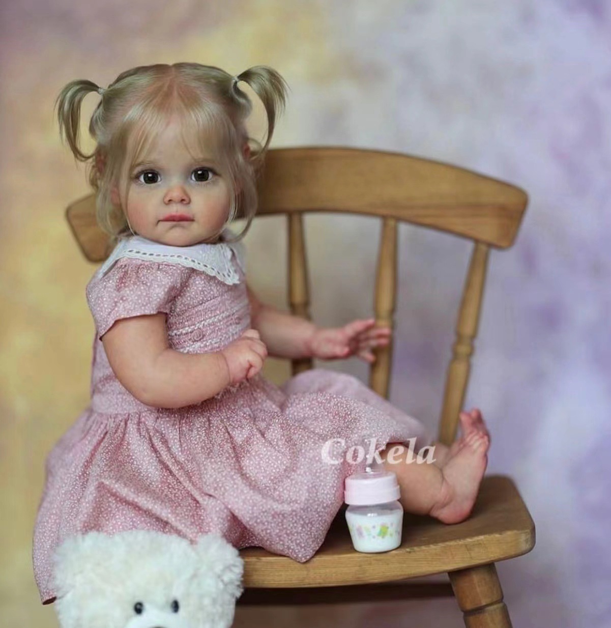 Cokela 58cm 3D simulación de alto color bebé renacido muñeca Maggi suministro transfronterizo entrega de una sola pieza