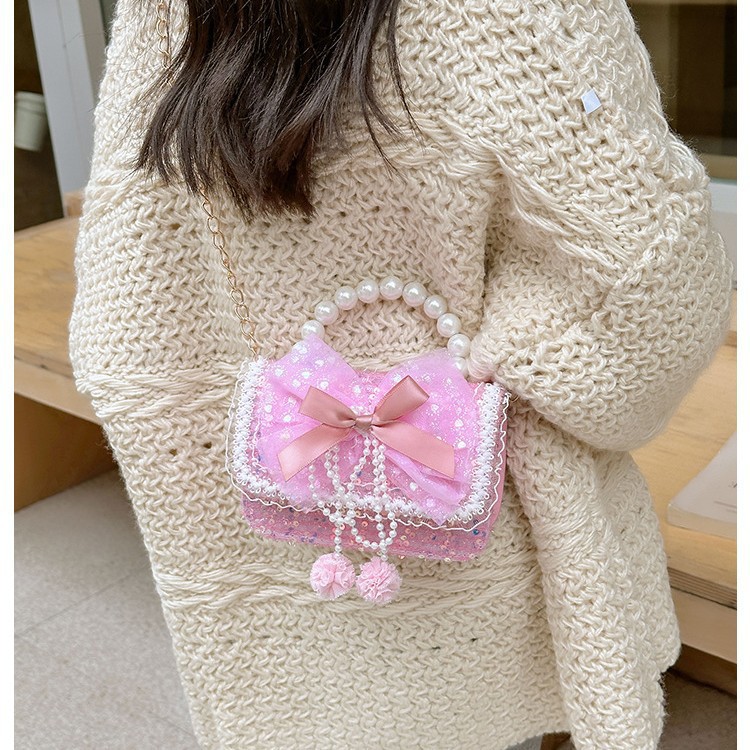 Otoño y invierno coreano arco camellia bolsas de niños de encaje de mano perlas bolsas mochilas para niñas de jardín de infantes