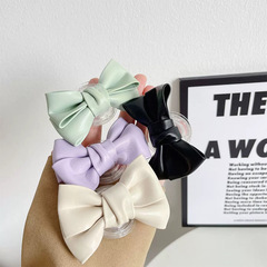 Creative mobile phone airbag holder, exquisite leather bow, lazy stick air cushion, retractable folding desktop holder