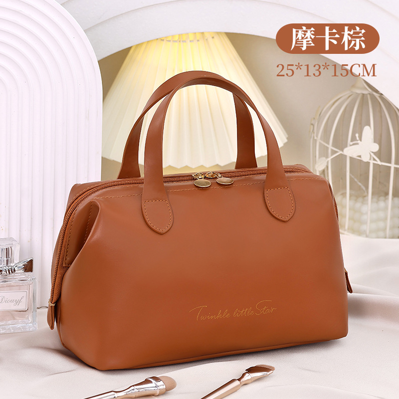 Nueva bolsa de cosméticos, estilo francés grande, alto valor, gran capacidad, sensación de alta gama, cosméticos de PU portátiles, almacenamiento de moda, viaje
