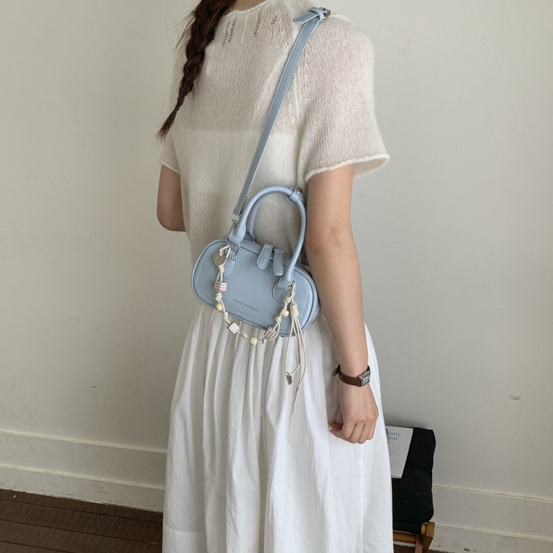 Bolsa de hombro coreana de diseño de nicho simple 2026 nueva moda femenina de tendencia diaria textura de viaje popular bolso de hombro