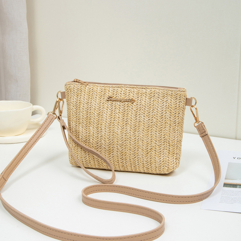 Bolso de verano para mujeres 2025, nuevo estilo de tela tejida bolso de paja de moda bolso de hombro con cámara bolso de mochila un cabello