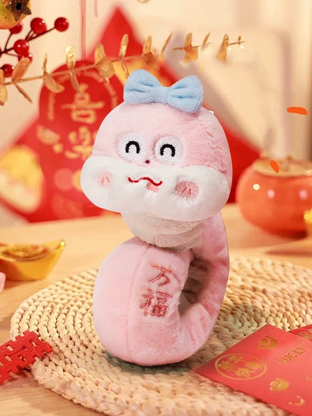 The mascot of the Year of the Snake (Wan Fu) is the little pink snake snapping circle