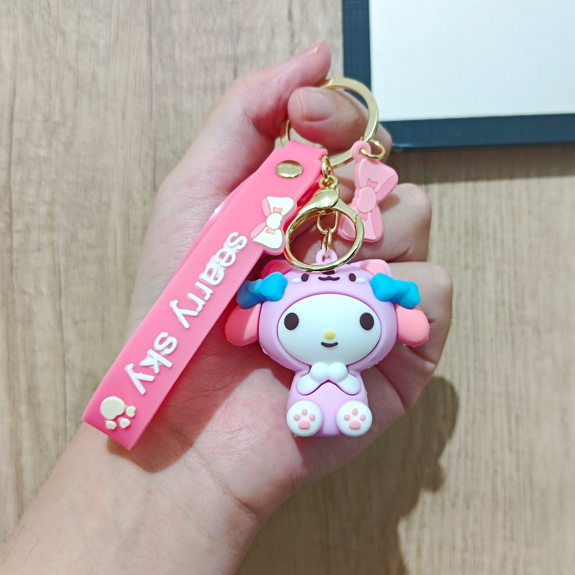 Perro de orejas grandes Melody KT gato pudín perro Kolomi caricatura de silicona llavero colgante bolsa colgante caja ciega regalo