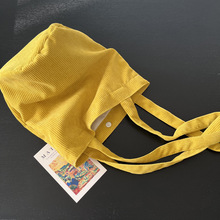 秋冬新款亮黄色灯芯绒圆筒包单肩包小众设计大容量立体水桶包女包