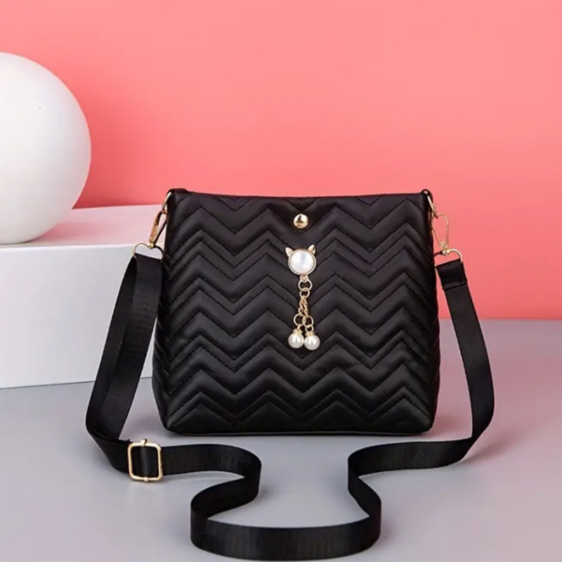 Moda coreana ondulada estriada felina colgante de perlas decoración simple bolsa de mujer mochila al por mayor bolsa image 7