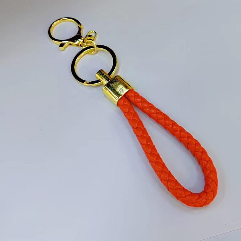 Ronda de la langosta hebilla PU cuero trenzado cuerda llavero hombres y mujeres amor llavero mano cuerda bolsa cordón fábrica directa al por mayor