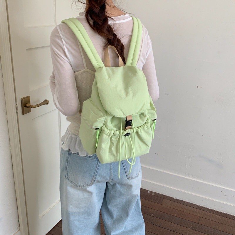 2026 más ocio simple de gran capacidad mochila de cuerda de extracción para estudiantes nueva mochila de bolsillo de mujer coreana de verano ligera