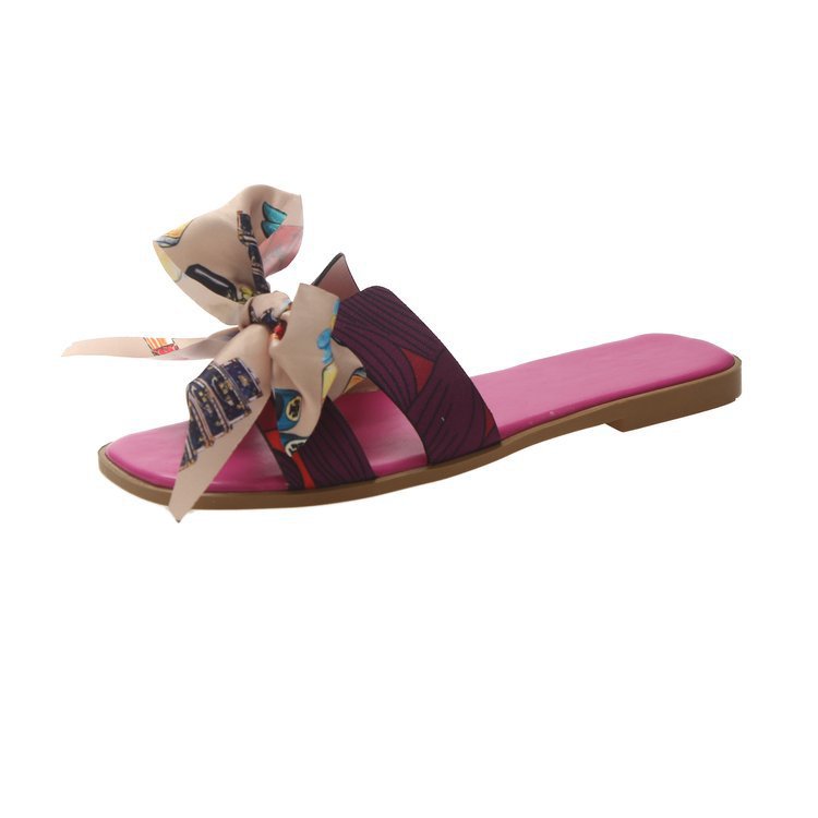 Cintas de colores zapatillas de arco de talón plano de verano para mujeres nuevas zapatillas de flores al por mayor
