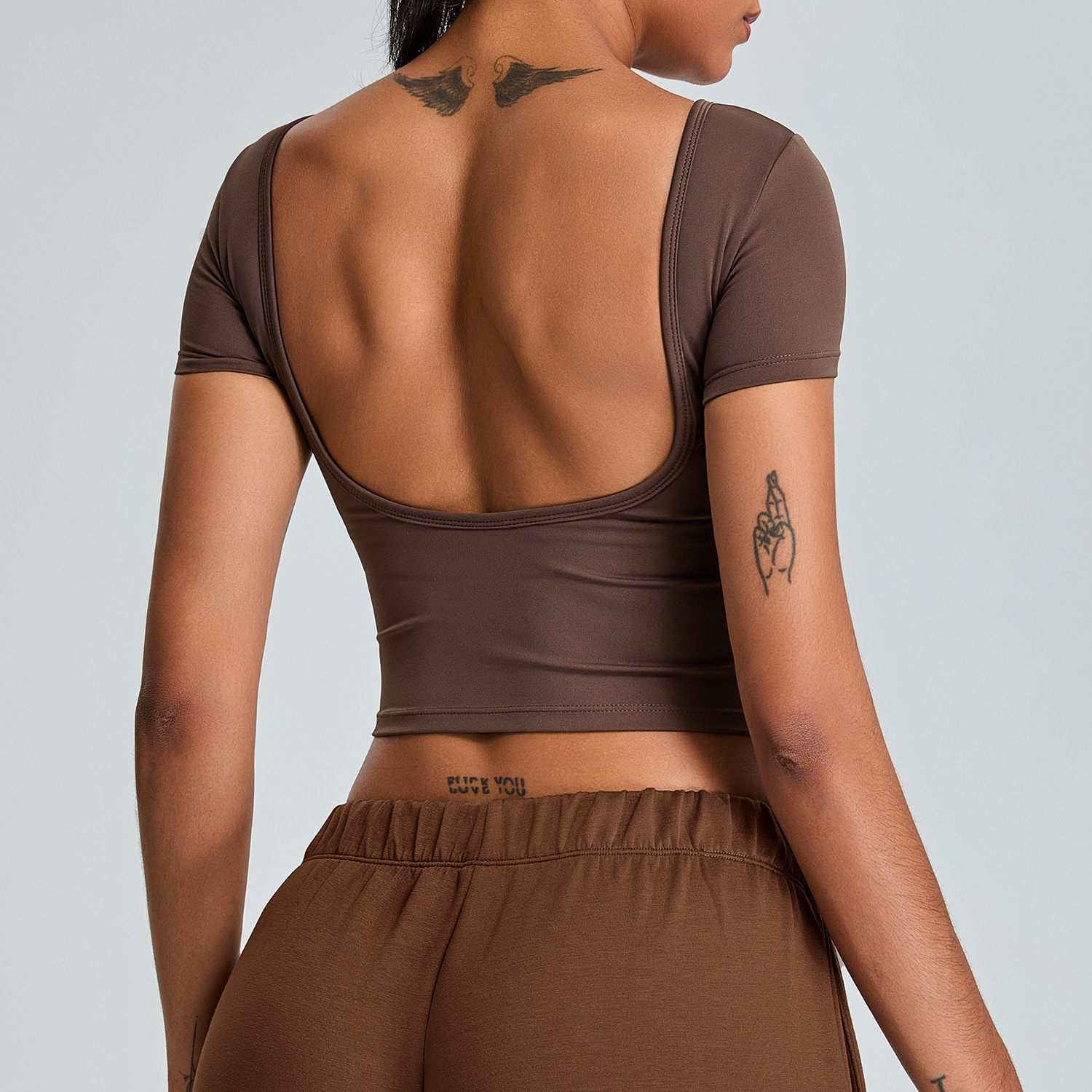 Tronos transfronterizos nueva ropa de yoga sin espalda para mujer, copa fija, espalda hermosa, top deportivo ajustado, de secado rápido, manga corta