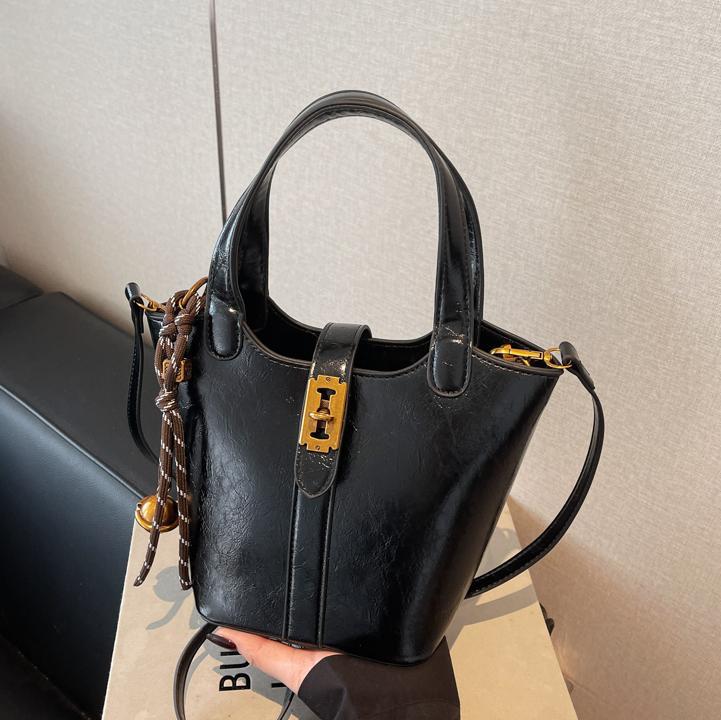 Moda retro bolso de cubo de mano para mujeres 2024 nuevo estilo coreano bolso de hombro casual de alta calidad humedad versátil bolso de mochila