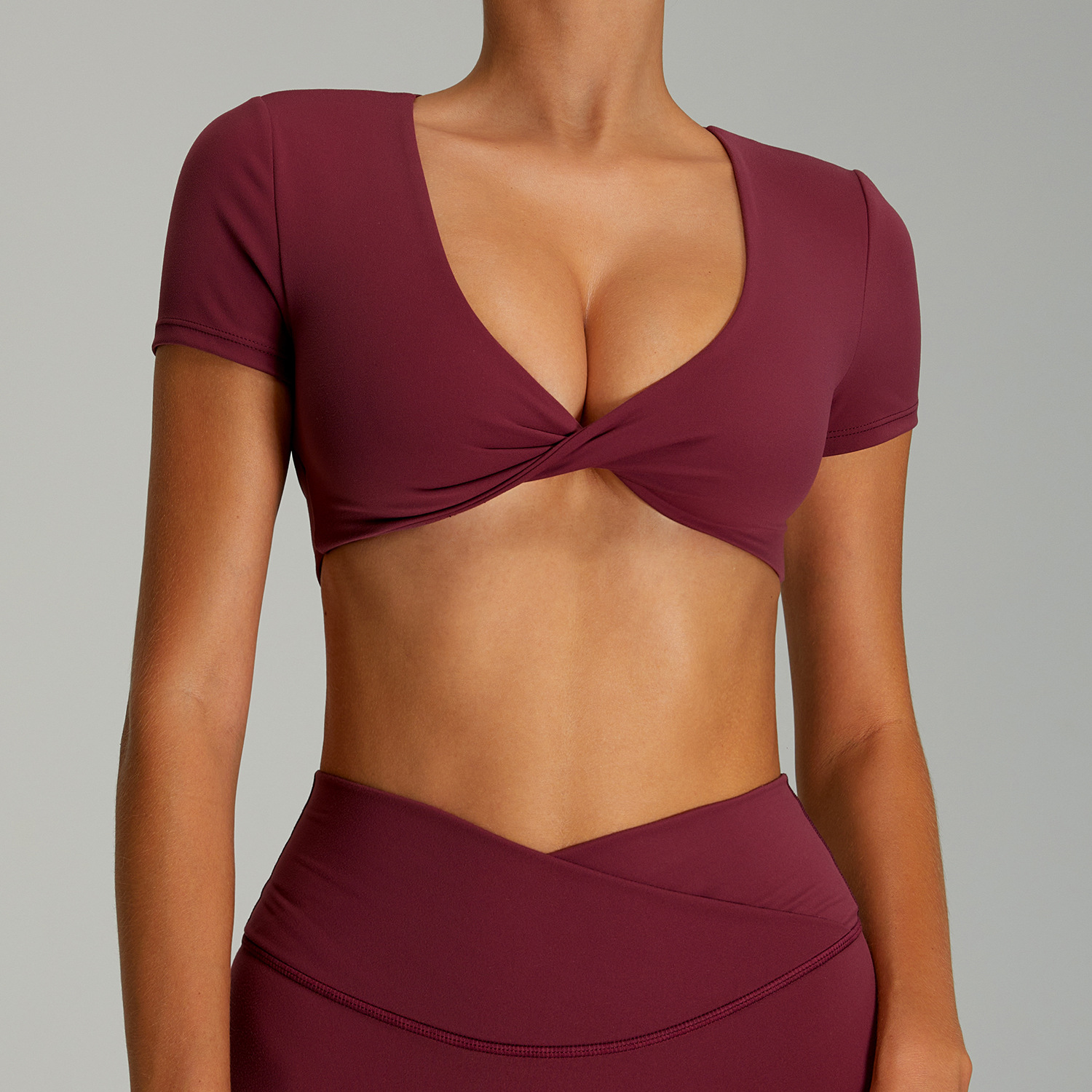 Camiseta deportiva sin espalda sexy femenina de manga corta de yoga de secado rápido europeo y americano con almohadilla para el pecho Top deportivo corto para correr