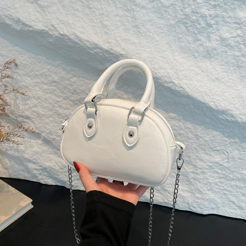 2024 nuevo temperamento diseño de moda bolso de hombro de color sólido estilo retro cremallera concha textura mochila