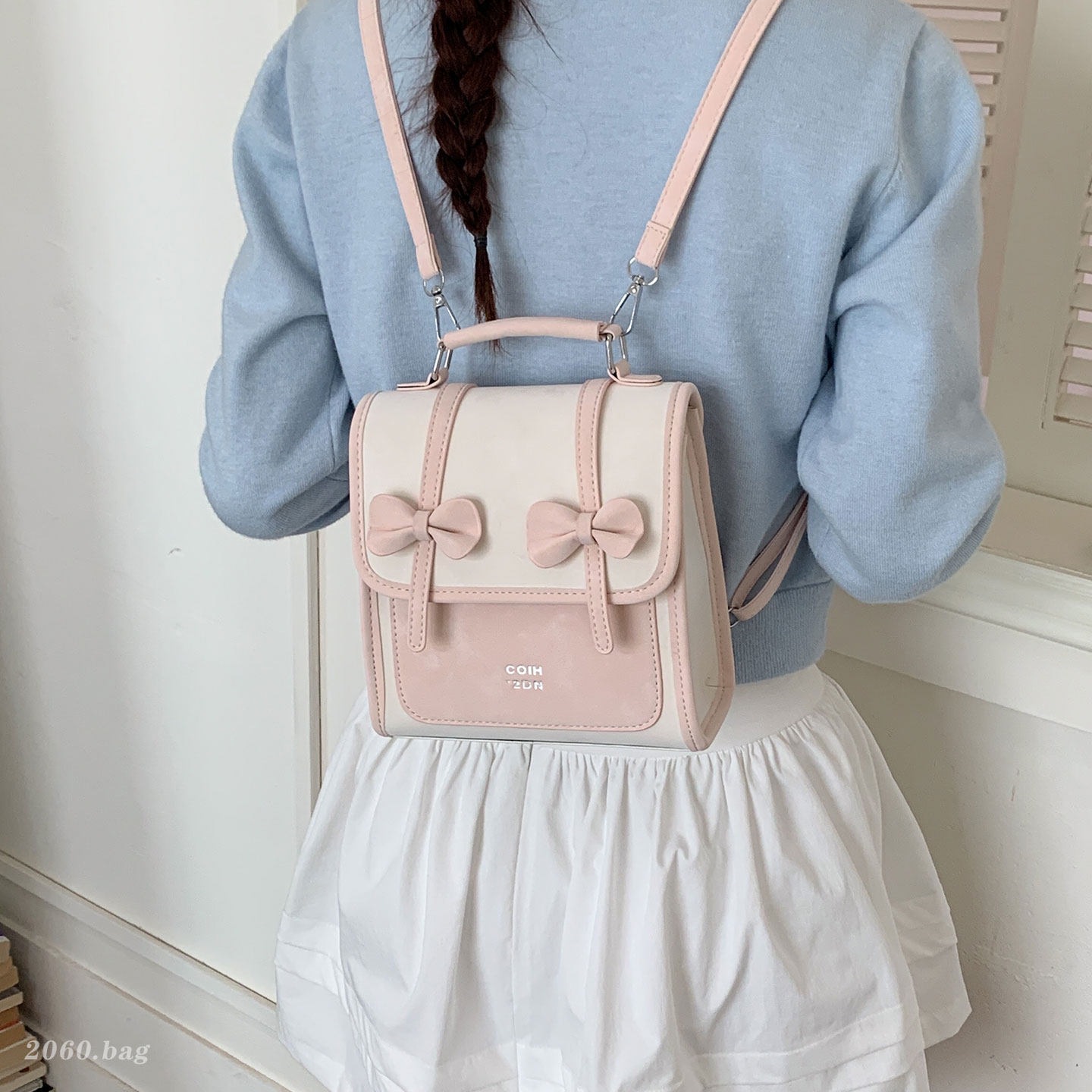 Mochila de temperamento de viaje femenino 2026 de alto valor de cara simple coreana mochila de viaje nuevo arco bolso pequeño