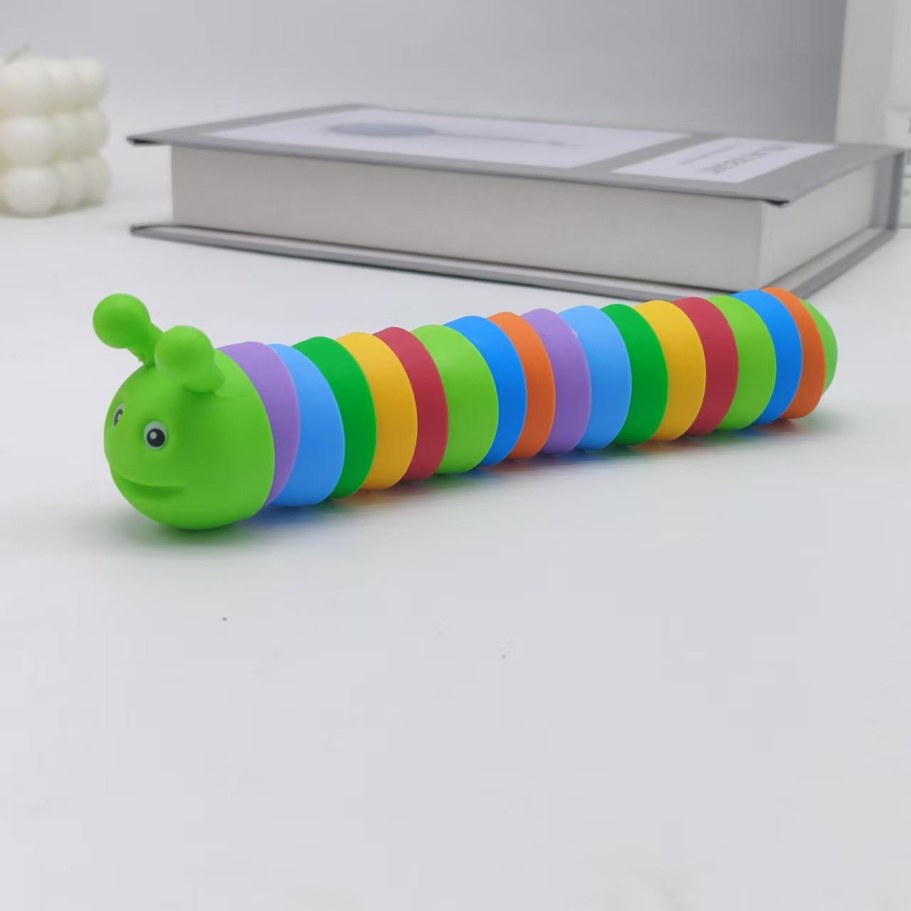 Explosiones transfronterizas simulación descomprimida arco iris sonriente nariz oruga peristáltica puzzles pequeños juguetes para niños animales mayoristas