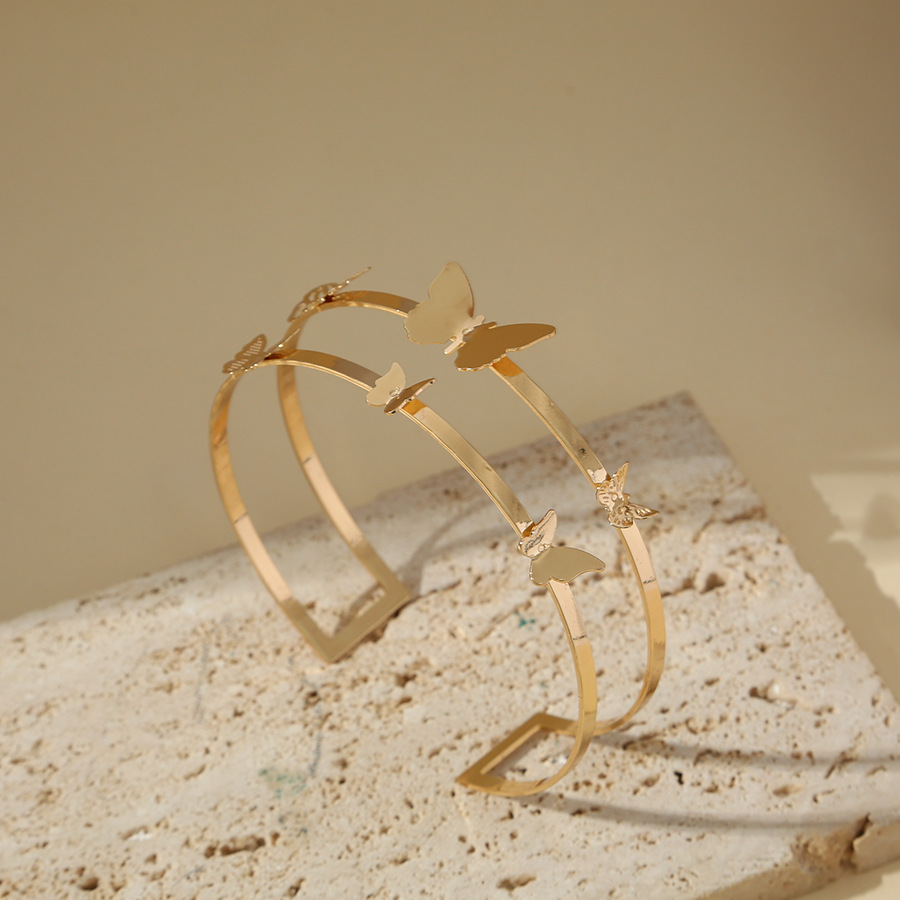 Amazon suministro directo pulsera de moda europea y americana simple anillo de brazo hueco mariposa brillante metal geométrico pulsera de brazo personalizada