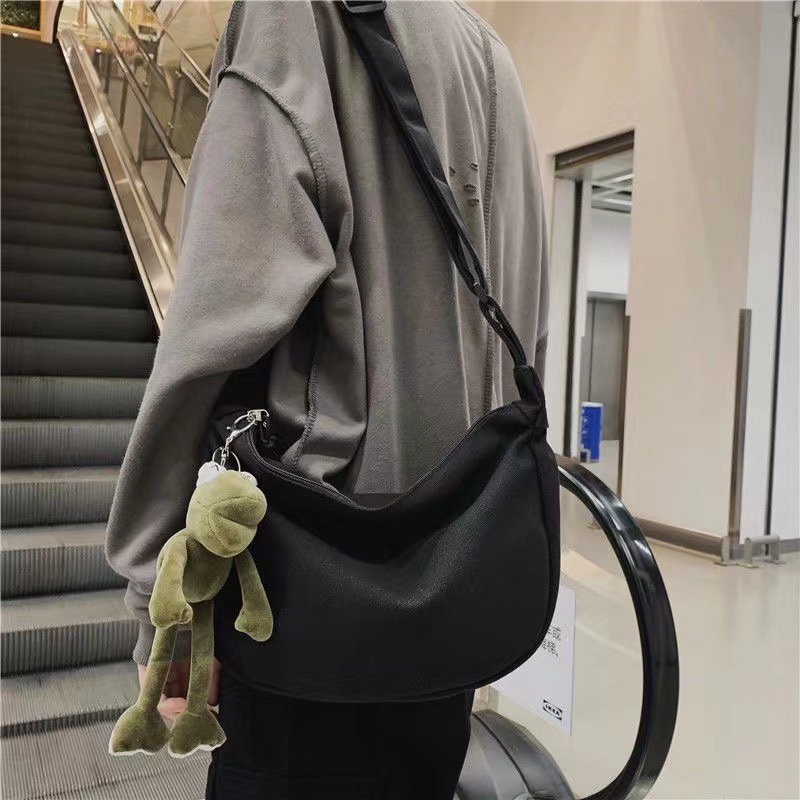 With pendant fashion single shoulder messenger bag large capacity simple wind men's backpack go out small bag manufacturers wholesale