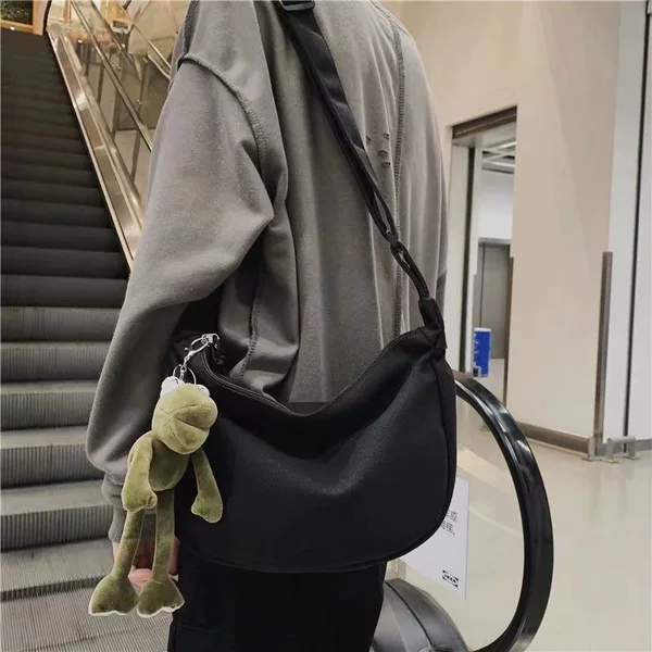 With pendant fashion single shoulder messenger bag large capacity simple wind men's backpack go out small bag manufacturers wholesale