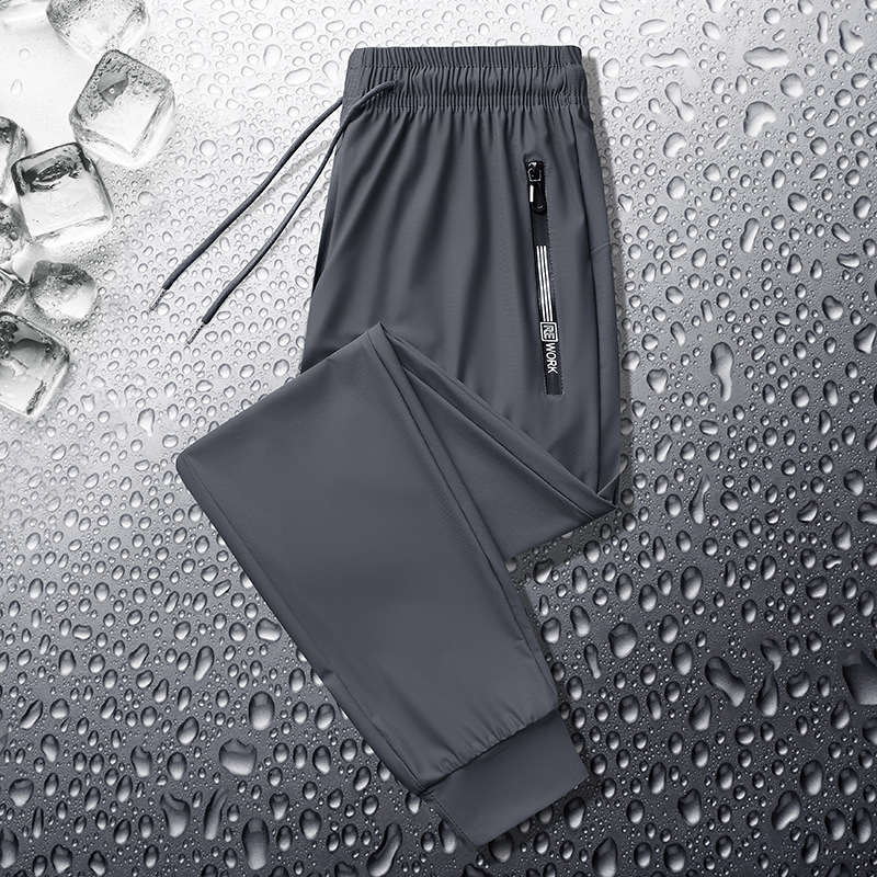 Pantalones deportivos casuales de seda de hielo para hombres pantalones de verano finos de punto de oro elásticos de secado rápido casuales atados al tobillo más pantalones de tamaño