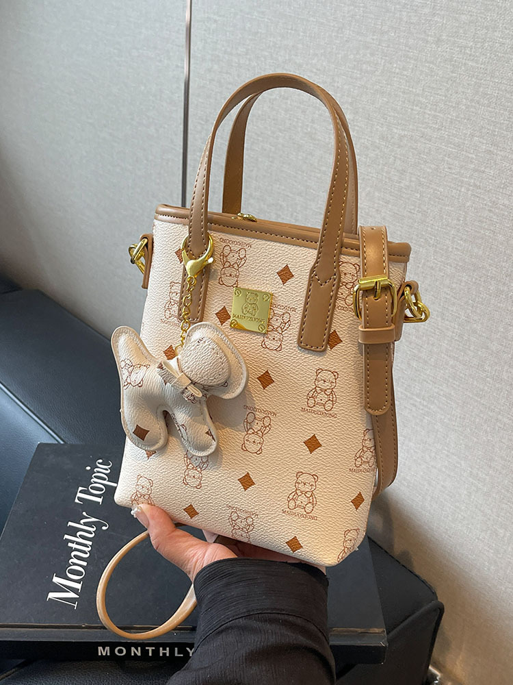 Bolsos de mujer transfronterizos nuevo bolso de diseño de nicho bolso de teléfono de oso de dibujos animados bolso de cubo de sentido avanzado bolso de mujer lindo