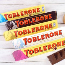 瑞士進口零食 TOBLERONE三角巴旦木糖蜂蜜葡萄干牛奶黑巧克力100g