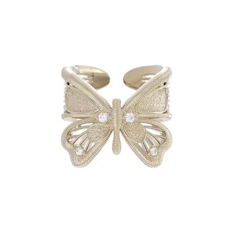 J001 butterfly ring titanium gold
