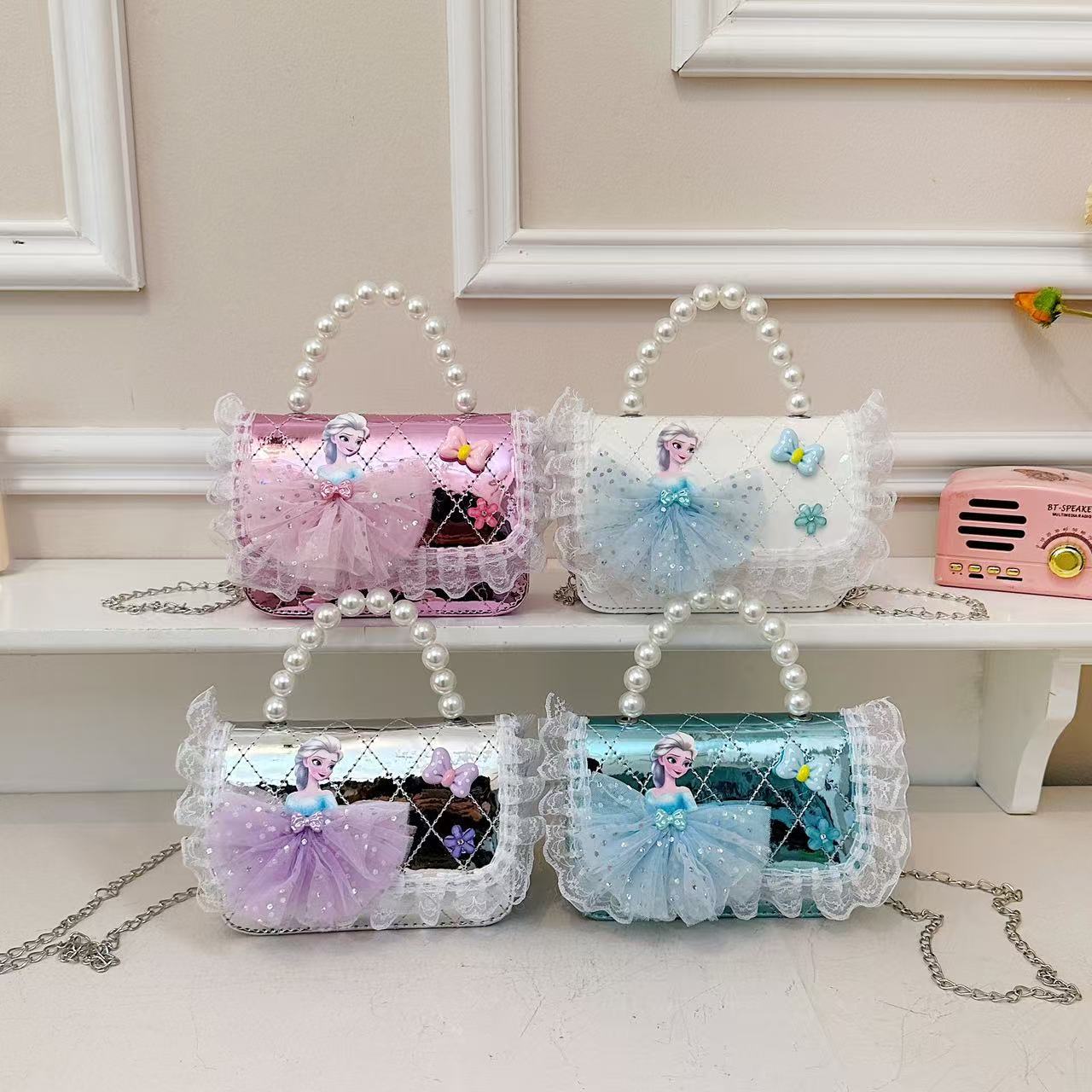 Nuevo comercio exterior pequeña fragancia niñas hombro mochila de moda perla arco bolsos de niños bolsos de cambio de dibujos animados