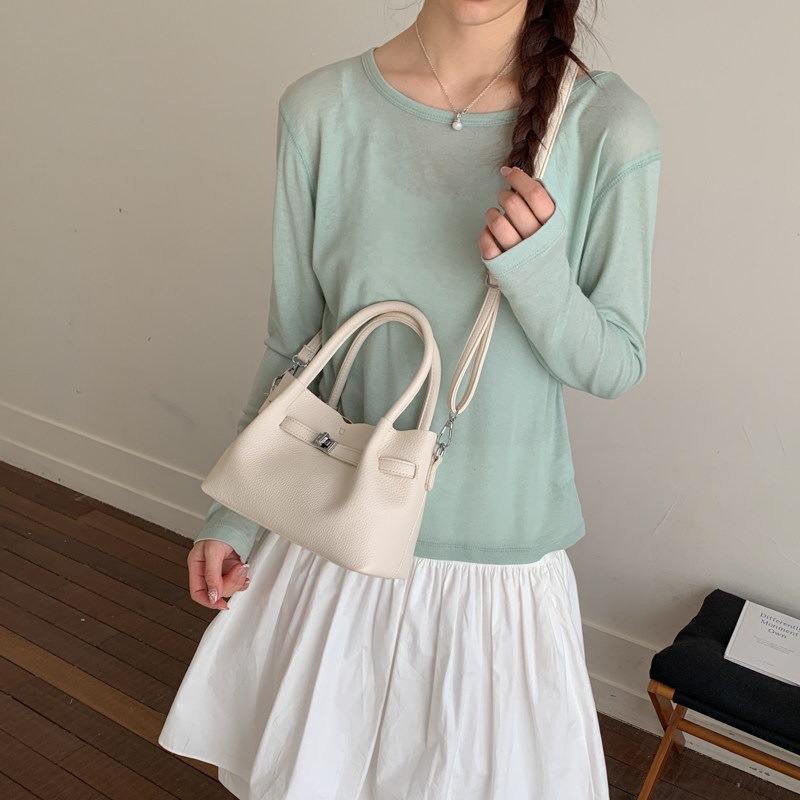 Simple portátil 2026 diseño de bolso de hombro único versátil estilo coreano de transporte de moda nuevo bolso de cubo nicho femenino