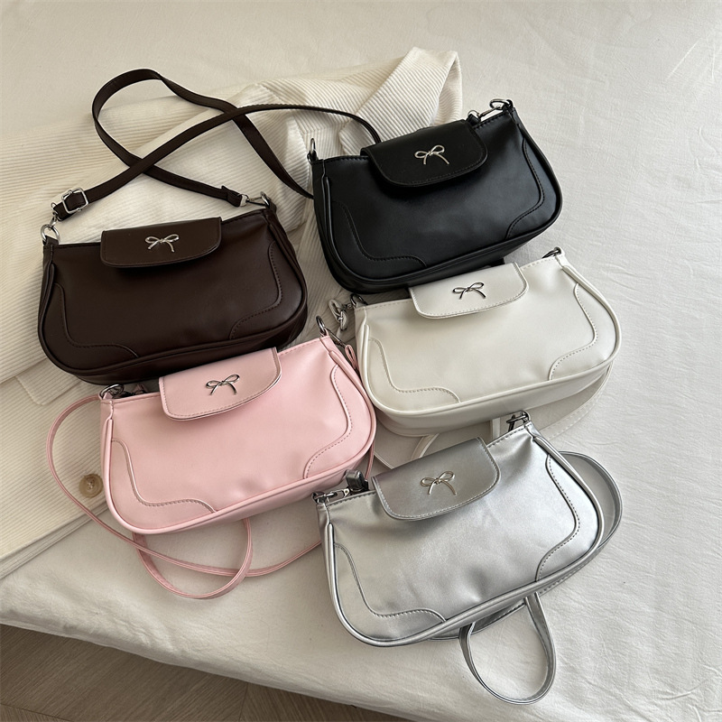 Bolsa de viaje retro para mujeres 2025, nueva moda, bolso de brazo de arco de moda, bolso de brazo elegante y dulce.