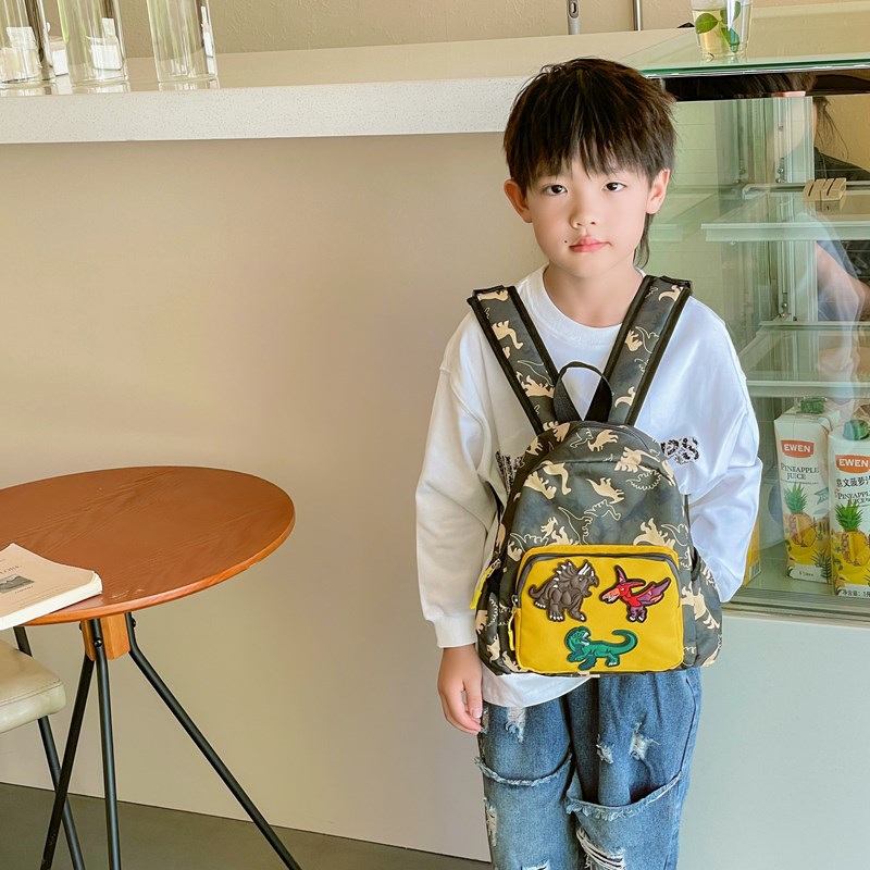 Mochila infantil de dinosaurios de dibujos animados, 2025 mochila escolar de jardín de infantes, nueva mochila de comercio exterior para niños y niñas
