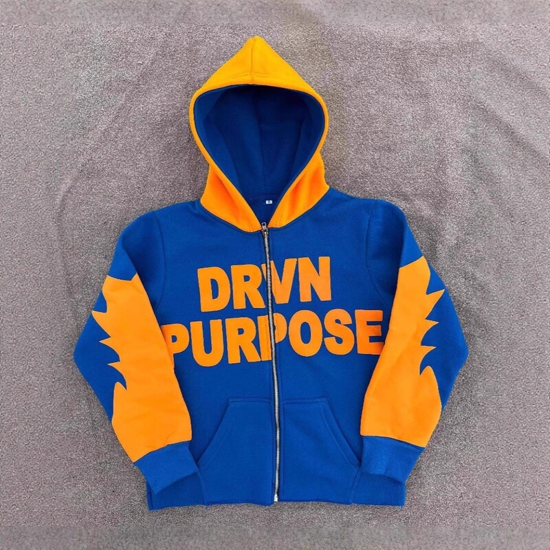Blue and orange color-blocked hooded cardigan with large letter print and serrated arm design, loose fit for comfort and casual style Blue and orange color-blocked hooded cardigan with large letter print and serrated arm design, loose fit for comfort and casual style