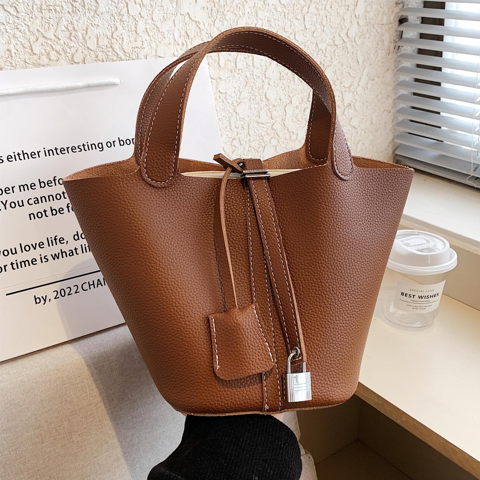 Bolsa de diseño de nicho de alta gama para mujeres 2023 nueva moda de moda simple bolsa de cubo popular bolsa de cesta de verduras portátil
