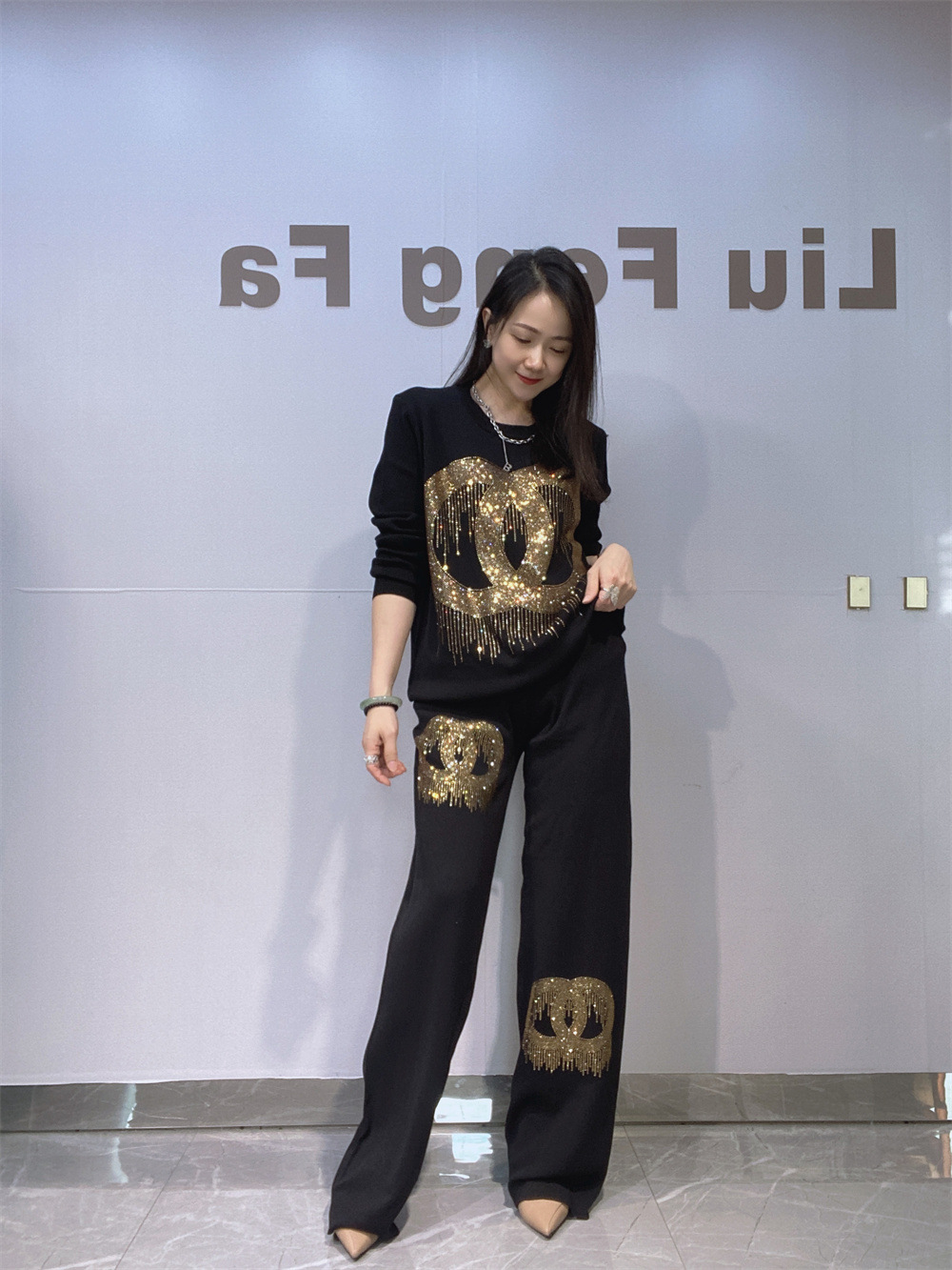 Industria pesada de diamante de agua transfronteriza ropa de mujer de moda europea y americana camiseta de punto de dos piezas para mujeres primavera y otoño pantalones casuales de piernas grandes set