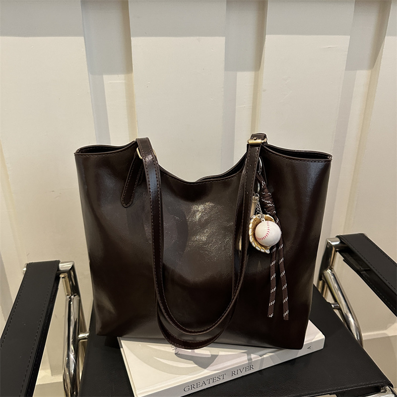 Bolsa de moda suave pittot2025 primavera nueva gran capacidad de viaje minimalista bolso de hombro para estudiantes universitarios