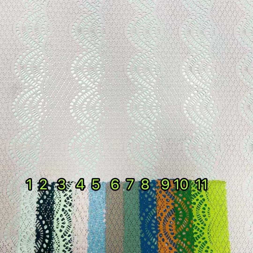 现货供应弹力贝壳花网布提花蕾丝面料泳装打底面料