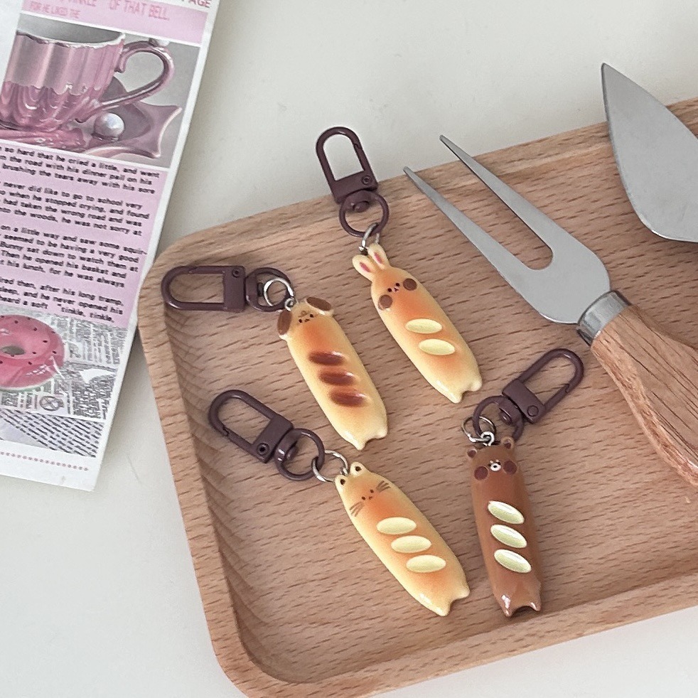 カレーボタンe 27うさぎの熊の棒のパンの食べ物と遊びのキーホルダーが可愛いです。