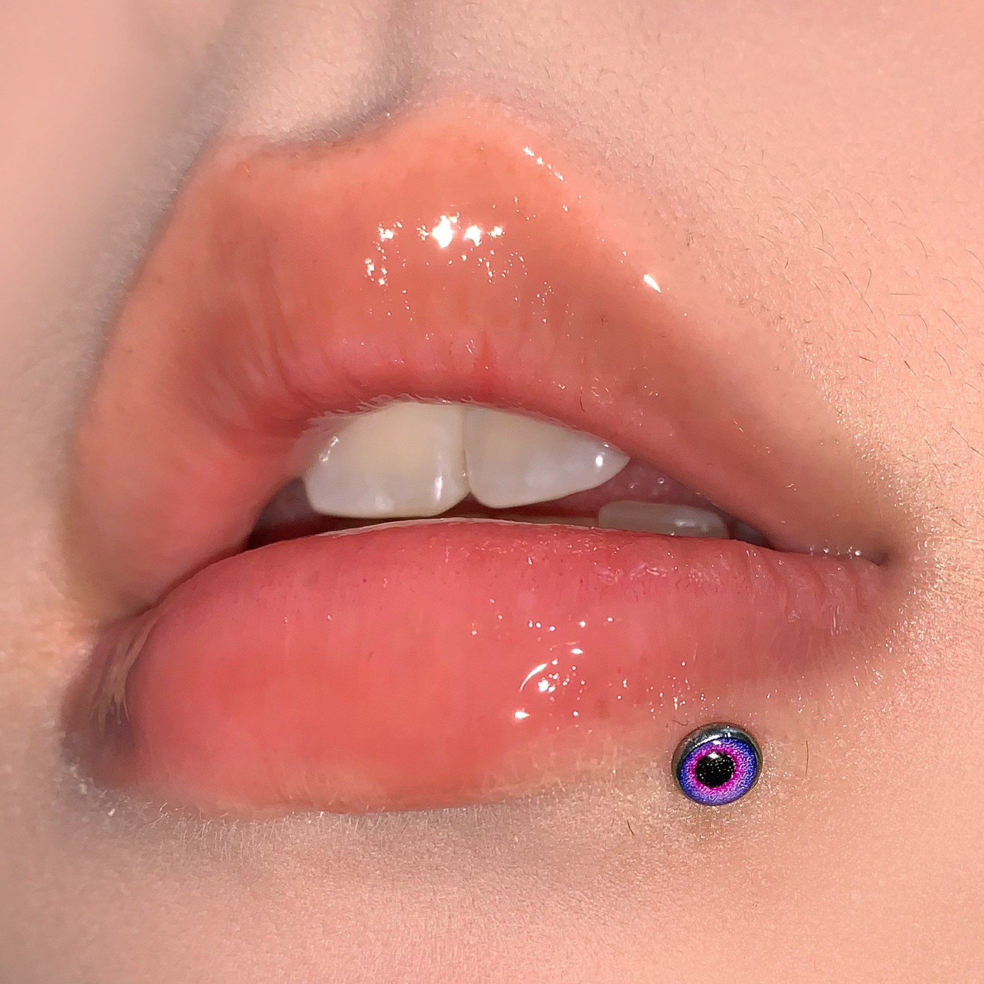 Silver pointed spike labret stud material detail