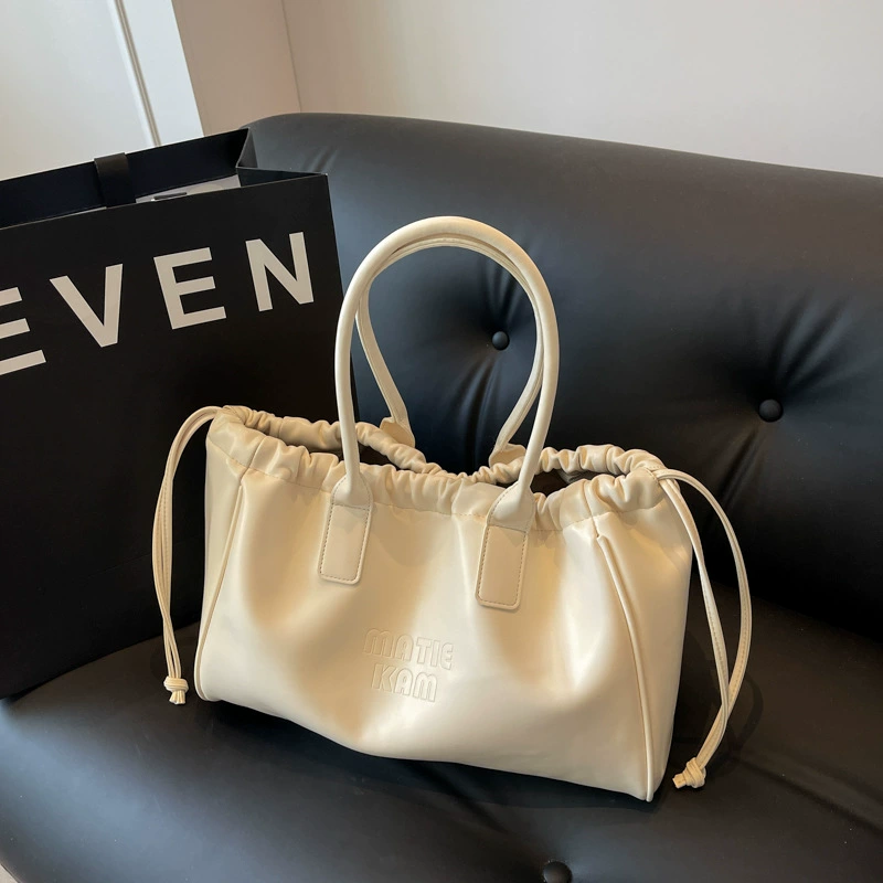 Universal small design shoulder bag, capacious one-shoulder bag, 2023 collection, genuine leather, drawstring