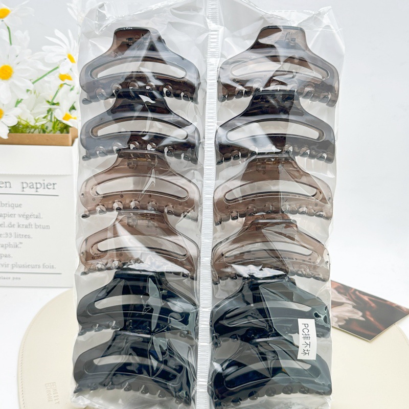Pinza para el cabello de material PC irrompible color té con leche, pinza grande transparente color café para la parte posterior de la cabeza, accesorio para el cabello de supermercado a dos yuanes.